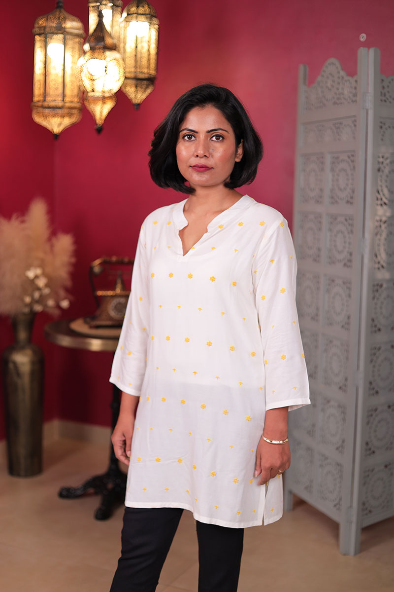 White Embroidered Kurta with Yellow Floral Motifs White Embroidered Kurta with Yellow Floral Motifs