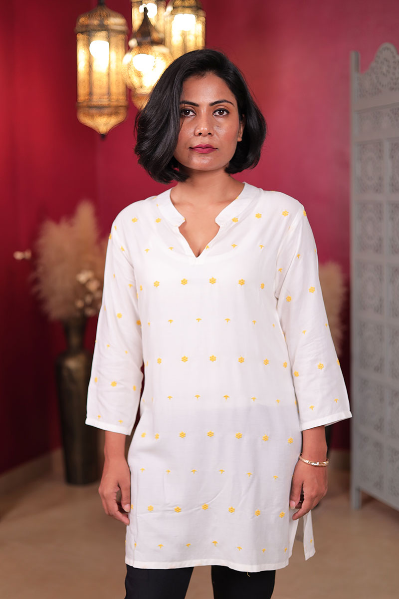 White Embroidered Kurta with Yellow Floral Motifs White Embroidered Kurta with Yellow Floral Motifs